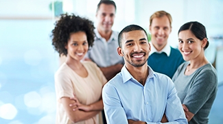  A group of young diverse colleagues standing in their office